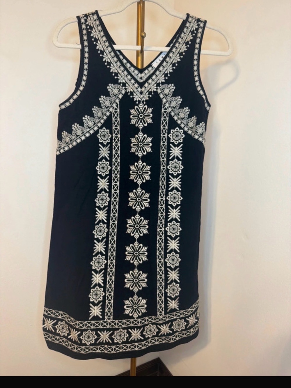 Sleeveless Black Dress with White Embroidered Floral Trim